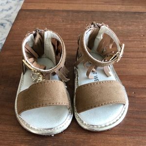 Brown baby fringe sandals by Stuart Weitzman